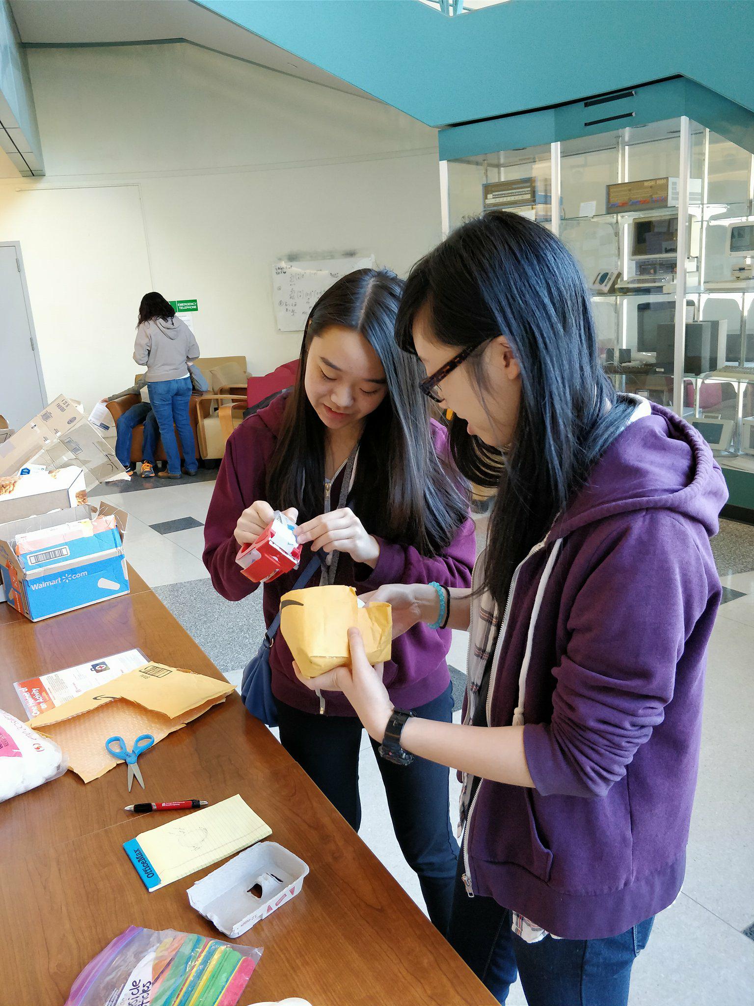 A volunteer and I working on the helmet